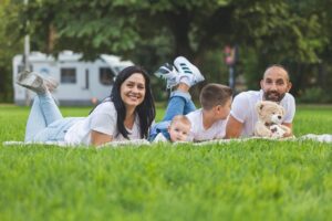 Happy parents enjoying time with their kids, smiling and sharing a joyful moment together